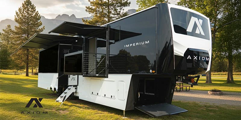 Big black and white RV parked in a park showcasing the external features