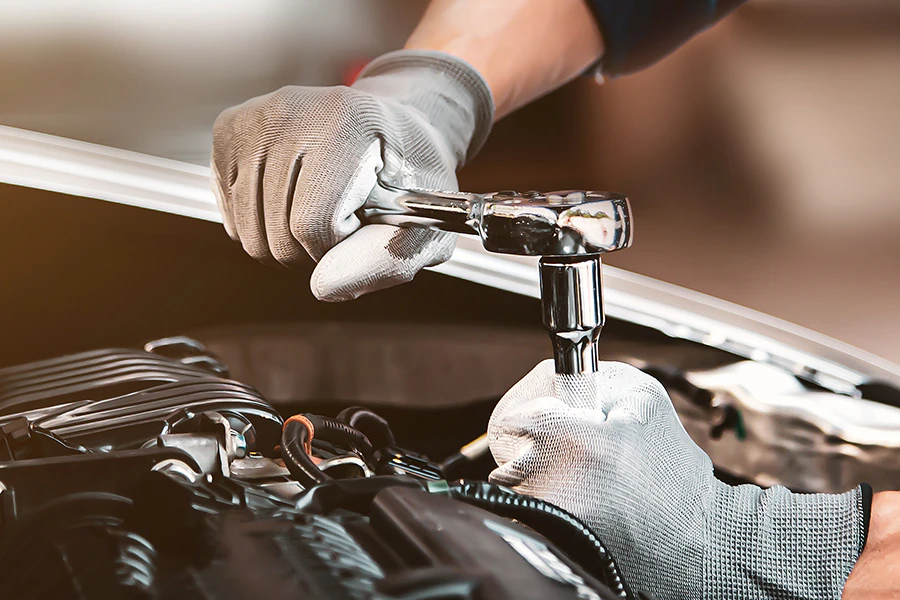service technician working on an engine