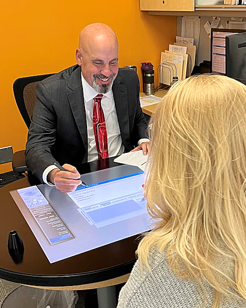 finance manager helping a client