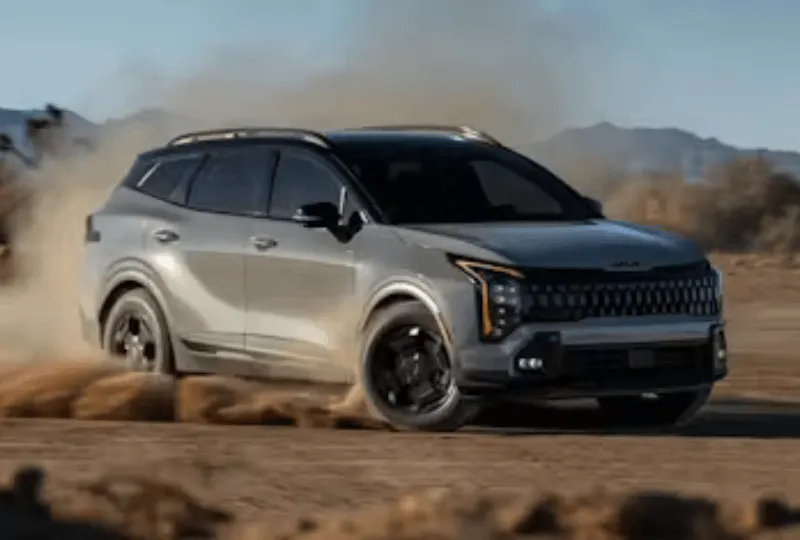 Kia SUV car driven on the sandy trail