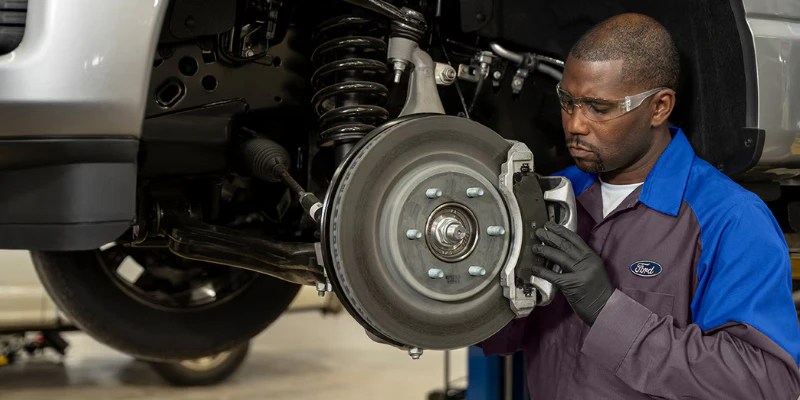 Ford technician fixing wheel