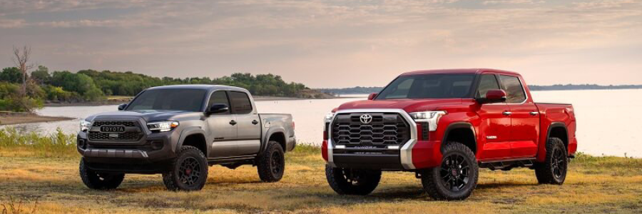 toyota tacoma and tundra by a lake
