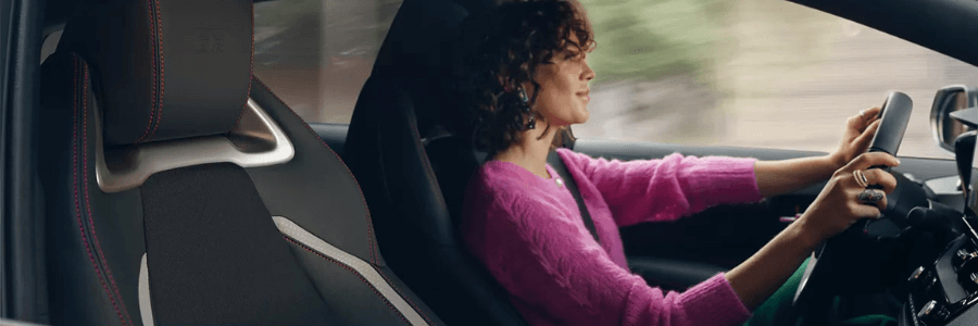 woman driving a Toyota vehicle