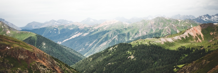 A panoramic of green, lush mountains near Vernon, BC