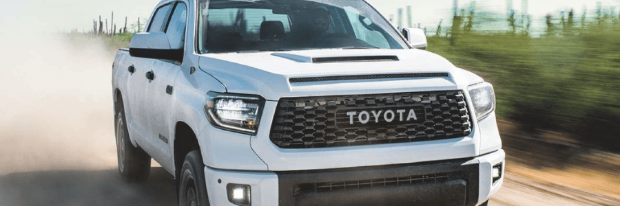 White Toyota Tundra in the dust