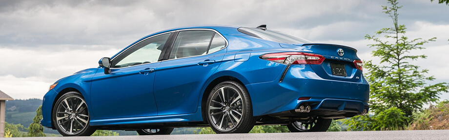 Blue 2018 Toyota Camry riding the streets