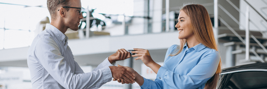 woman selling her car at a dealership