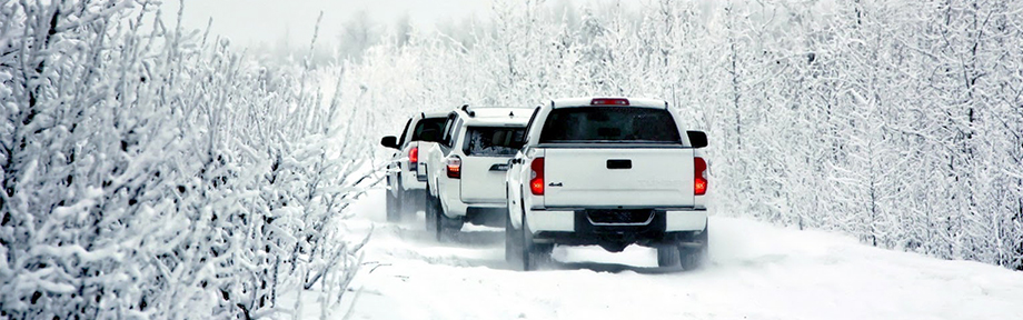 4runners on a snowy road