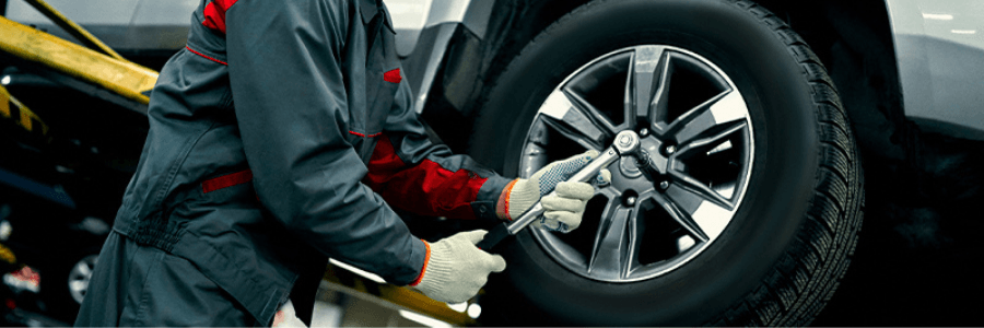 Featured Image toyota technician working on tires
