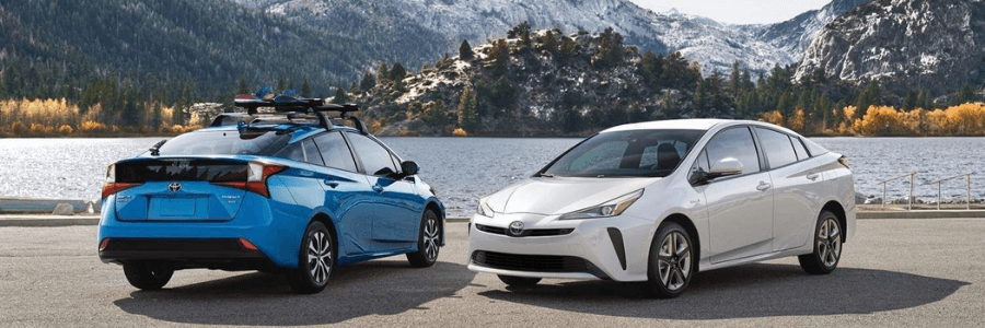 Prius cars in front of a mountain