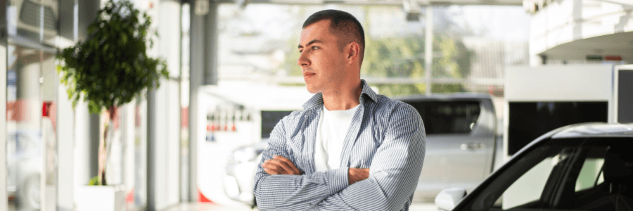 man in thought at rv dealership