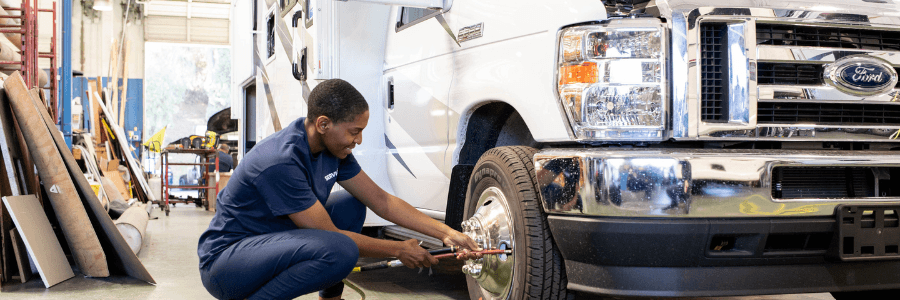 woman repairing rv