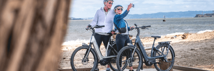 couple taking a photo on ebikes