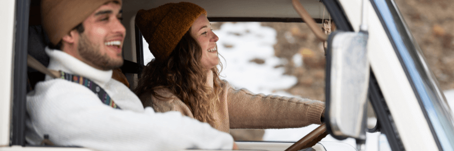 winter couple riding in an rv