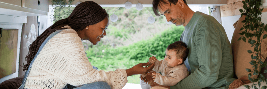 couple with baby in an rv