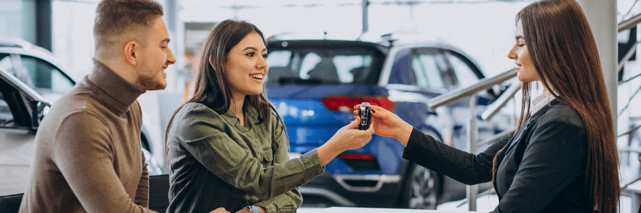 couple at a car dealership