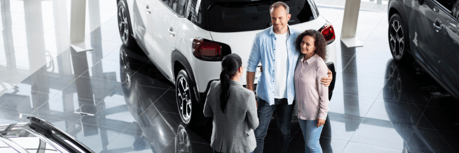 couple at car dealership