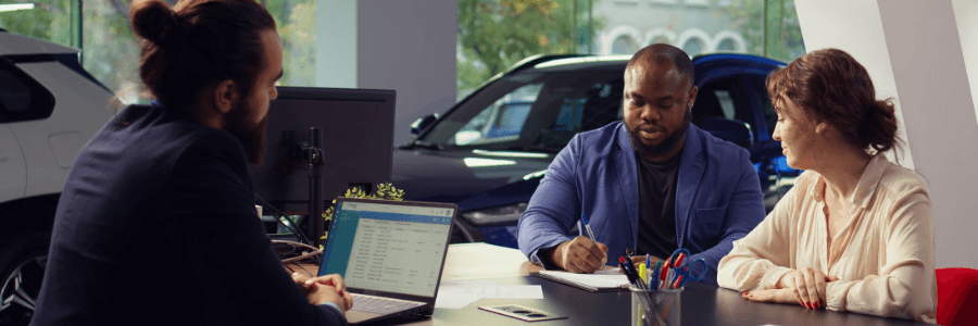 couple at a dealership office
