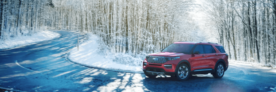 Ford SUV against snowy winter trail