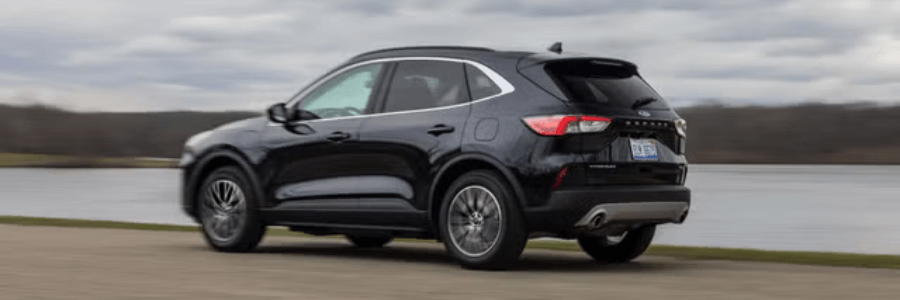 ford escape hybrid driving along the highway