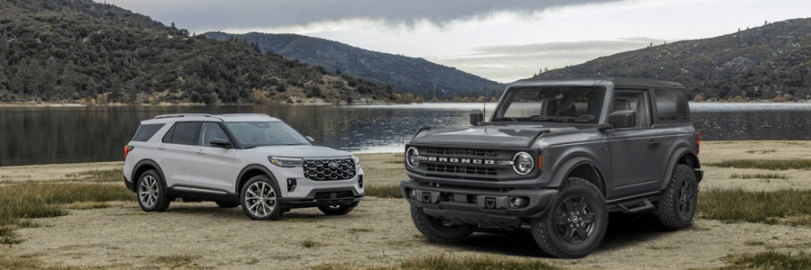 ford explorer and bronco at a lake