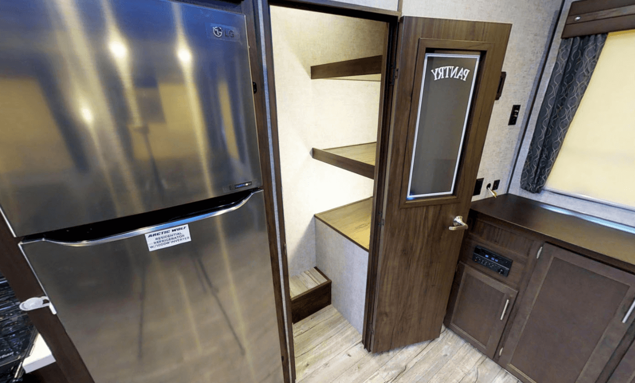 Stainless steel fridge inside Arctic Wolf RV unit