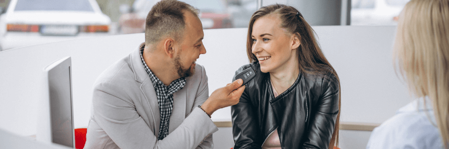couple buying from a dealership