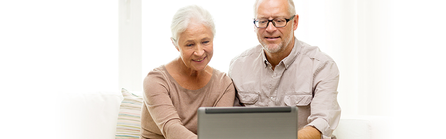 Elderly couple using a computer