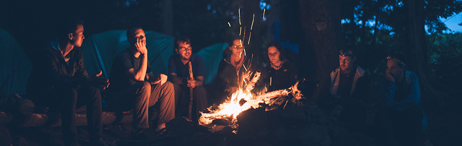 Group of friends in the dark around a campfire in kamloops, bc