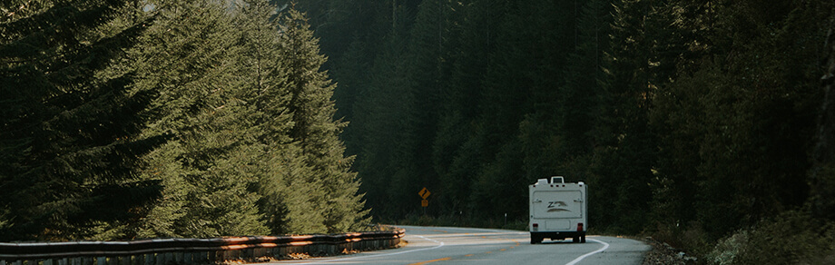 Image of a fifth-wheel trailer driving on the Trans Canada from Kamloops