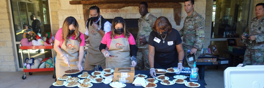 group of people serving lunch at a military event