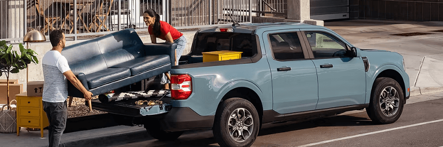 Featured Image couple loading a pickup truck bed