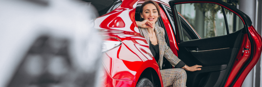 woman in a red car