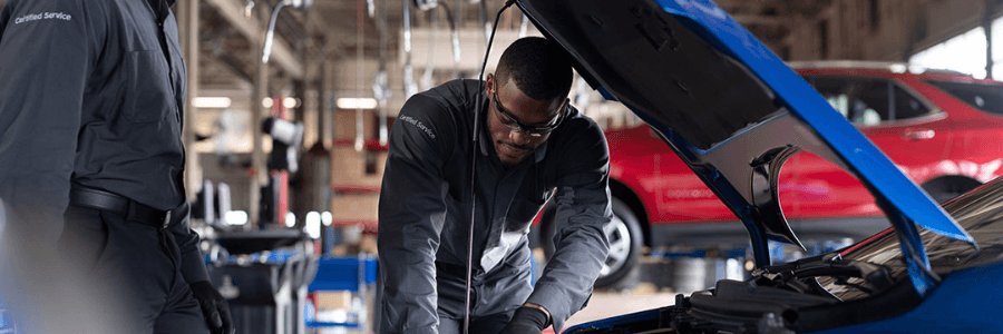 Featured Image chevrolet service technicians servicing a vehicle
