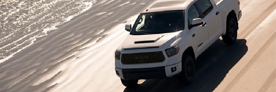 White Tundra TRD Pro drives on beach in Whitehorse