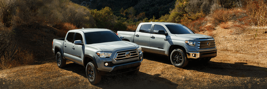 Tundra and Tacoma sitting side by side in an empty field