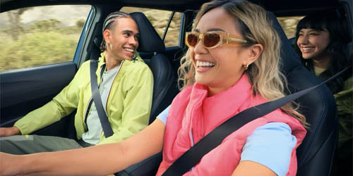 students riding in a car
