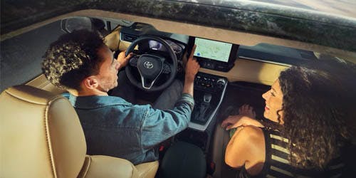 a couple riding their toyota vehicle