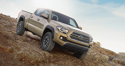 Brown 2016 Toyota Tacoma off-roading