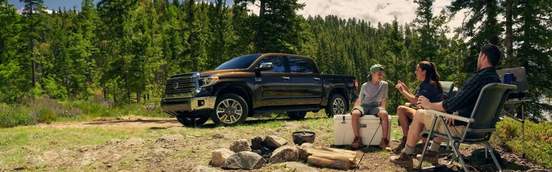 A Toyota truck and a family relaxing in Kootenays trail
