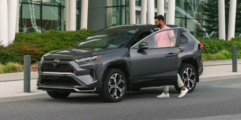 A used car grey Toyota RAV4 SUV on a street