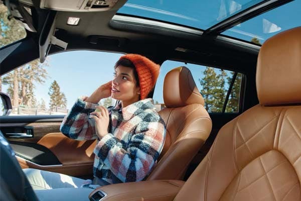 woman in the passenger seat of a toyota vehicle