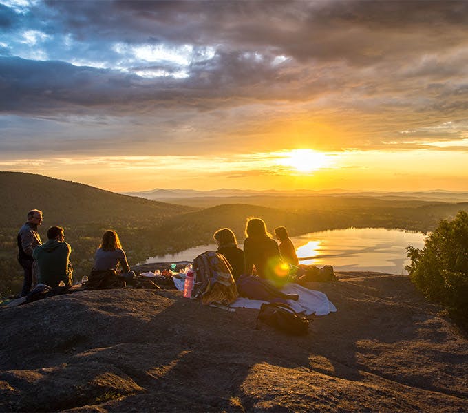 friends camping with sunset