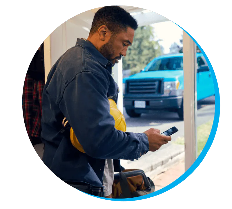 ICBC Collision technician checking his phone 