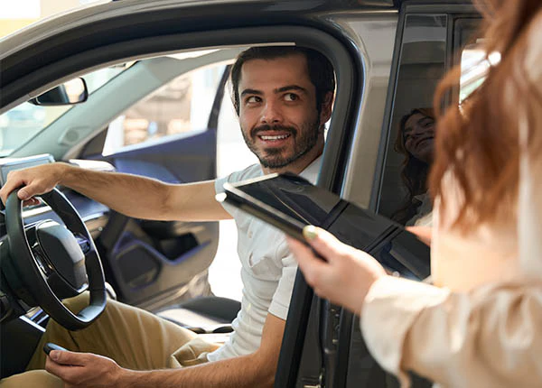 joyous-buyer-communicating-with-automotive-sales