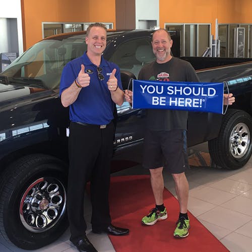 Mike selling vehicle to happy customer