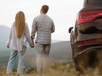 couple beside a car