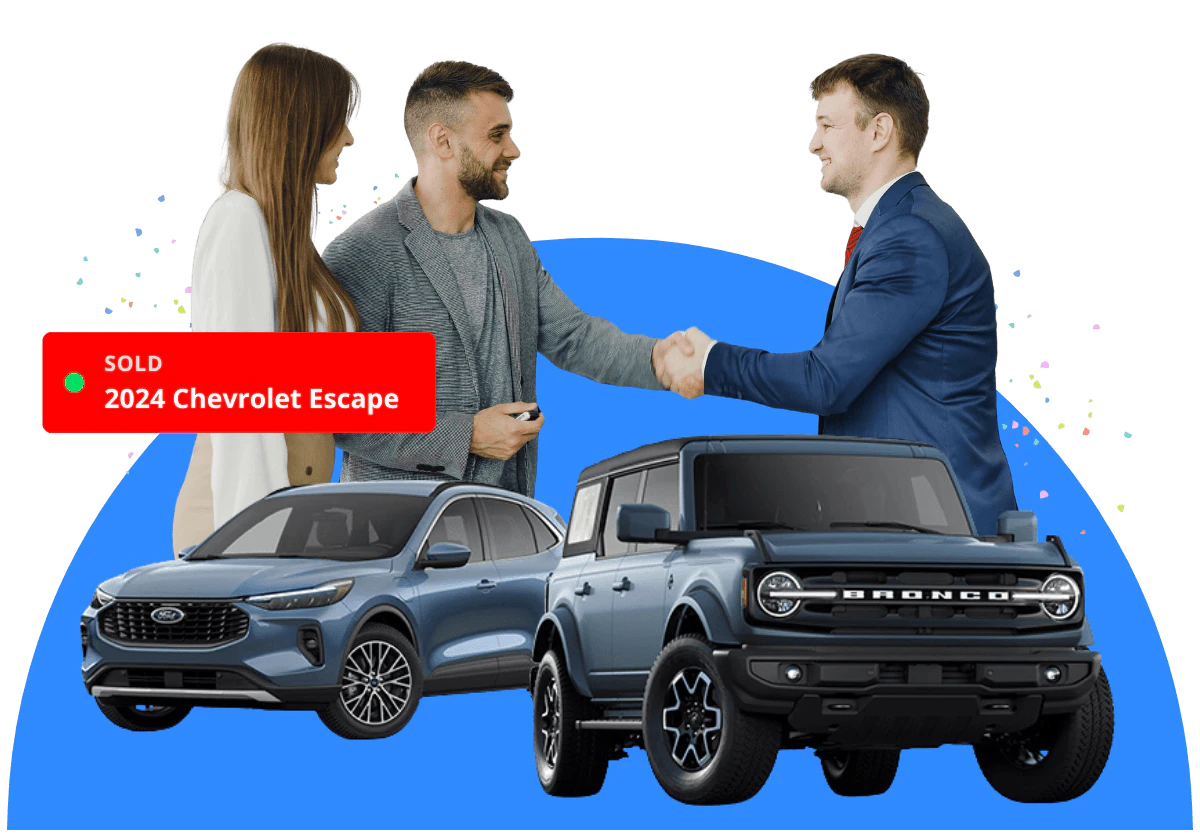 A car sales person shaking hands with a couple
