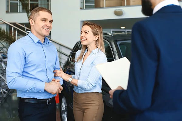 man and woman having a pleasant conversation with a finance emplyee