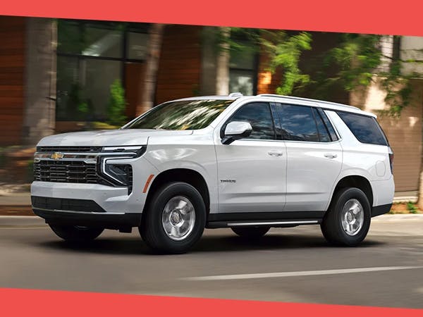 White chevrolet SUV driving on street